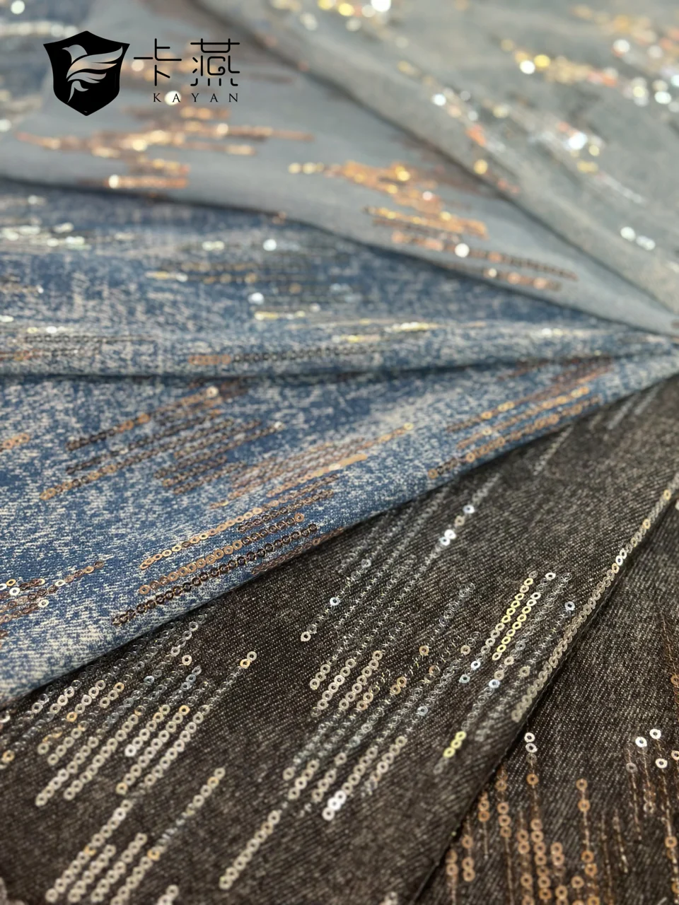 KS-96570: Rows of reflective accents cross a blue textile surface, catching the light as the material folds.
