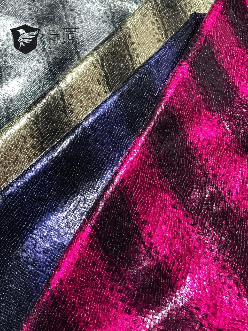 KS-97300: A reflective surface in contrasting colourways, with a fine repeating texture visible in close-up.
